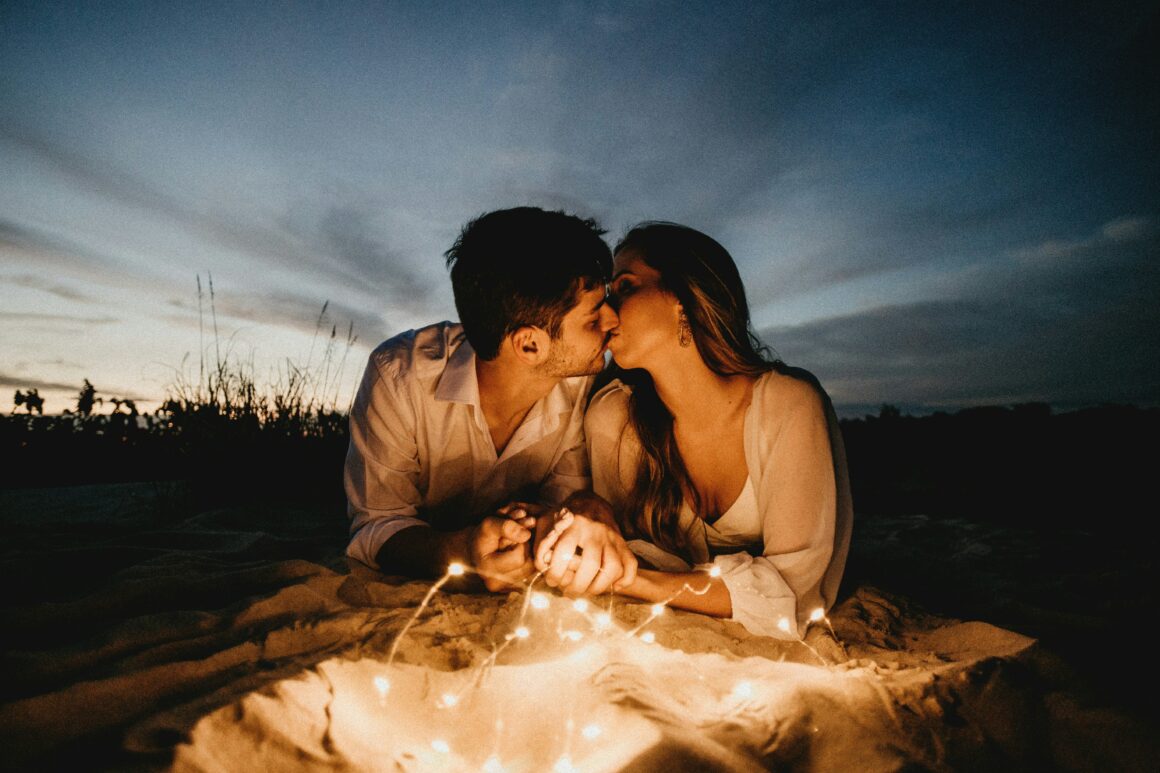 woman and man kissing on a field 10 Clear Signs That You Have an Unexplainable Connection With Someone